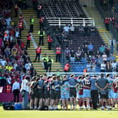 Burnley's players and staff huddle at the end of the English Premier League football match between Burnley and Nottingham Forest at Turf Moor in Burnley, north-west England on May 19, 2024. (Photo by ANDY BUCHANAN / AFP)publications. /  (Photo by ANDY BUCHANAN/AFP via Getty Images)