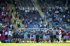 Burnley's players and staff huddle at the end of the English Premier League football match between Burnley and Nottingham Forest at Turf Moor in Burnley, north-west England on May 19, 2024. (Photo by ANDY BUCHANAN / AFP)publications. /  (Photo by ANDY BUCHANAN/AFP via Getty Images)