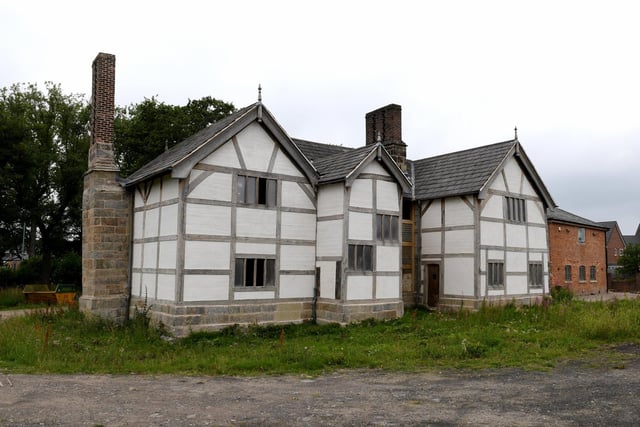 Buckshaw Hall, near Chorley. The timber-framed former manor house has been partly restored, and there are plans for four houses in the grounds to help fund future repairs, but the listed building still appears on Historic England's at-risk register.
