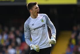 Burnley's English goalkeeper Nick Pope celebrates after Burnley's English midfielder Jack Cork scores during the English Premier League football match between Watford and Burnley at Vicarage Road Stadium in Watford, north-west of London, on April 30, 2022. - RESTRICTED TO EDITORIAL USE. No use with unauthorized audio, video, data, fixture lists, club/league logos or 'live' services. Online in-match use limited to 120 images. An additional 40 images may be used in extra time. No video emulation. Social media in-match use limited to 120 images. An additional 40 images may be used in extra time. No use in betting publications, games or single club/league/player publications. (Photo by Glyn KIRK / AFP) / RESTRICTED TO EDITORIAL USE. No use with unauthorized audio, video, data, fixture lists, club/league logos or 'live' services. Online in-match use limited to 120 images. An additional 40 images may be used in extra time. No video emulation. Social media in-match use limited to 120 images. An additional 40 images may be used in extra time. No use in betting publications, games or single club/league/player publications. / RESTRICTED TO EDITORIAL USE. No use with unauthorized audio, video, data, fixture lists, club/league logos or 'live' services. Online in-match use limited to 120 images. An additional 40 images may be used in extra time. No video emulation. Social media in-match use limited to 120 images. An additional 40 images may be used in extra time. No use in betting publications, games or single club/league/player publications. (Photo by GLYN KIRK/AFP via Getty Images)