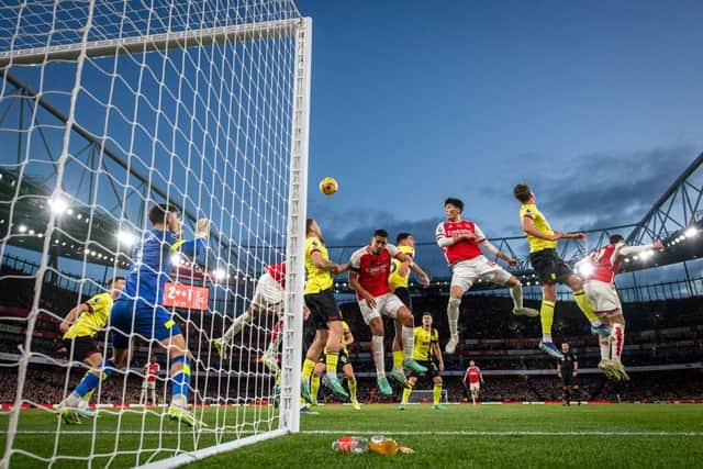 LONDON, ENGLAND - NOVEMBER 11: Takehiro Tomiyasu of Arsenal and Gabriel of Arsenal compete for the ball from a corner during the Premier League match between Arsenal FC and Burnley FC at Emirates Stadium on November 11, 2023 in London, England. (Photo by Justin Setterfield/Getty Images)