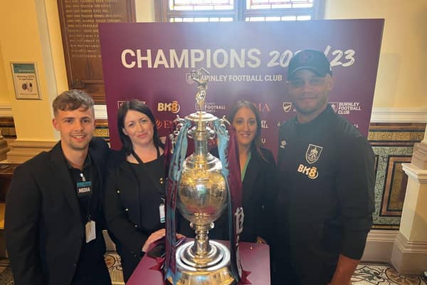 Burnley Brand Manager Rachel Bayley (third from left) with Burnley FC manager Vincent Kompany and her colleagues Luke Pollard and Katie McGee