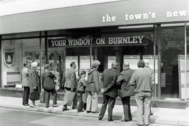 Crowds of Friday shoppers take the opportunity to read the local election results in the Burnley Express display window. Bull Street, Burnley. May 18, 1976.