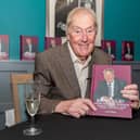 Former Burnley chairman Barry Kilby with his new book Starting From Scratch. Photo: Kelvin Stuttard