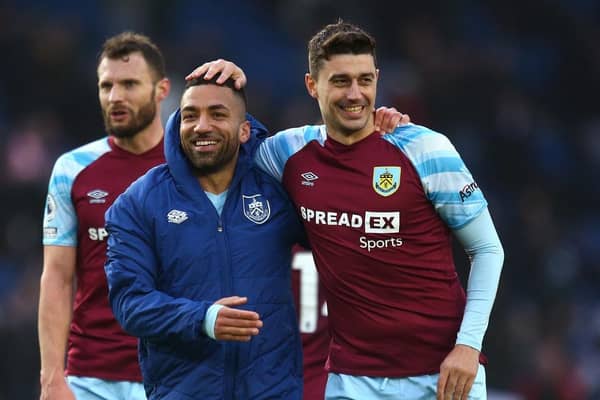 BRIGHTON, ENGLAND - FEBRUARY 19: Aaron Lennon of Burnley embraces Matthew Lowton following their sides victory in the Premier League match between Brighton & Hove Albion and Burnley at American Express Community Stadium on February 19, 2022 in Brighton, England. (Photo by Charlie Crowhurst/Getty Images)