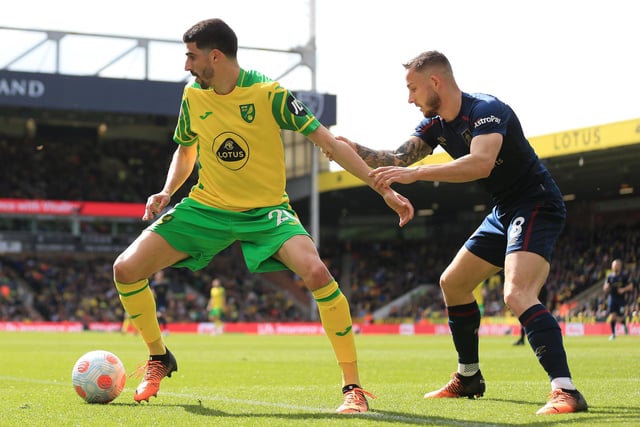 NORWICH, ENGLAND - APRIL 10: Pierre Lees Melou of Norwich City battles for possession with Josh Brownhill of Burnley during the Premier League match between Norwich City and Burnley at Carrow Road on April 10, 2022 in Norwich, England. (Photo by Stephen Pond/Getty Images)