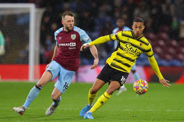 BURNLEY, ENGLAND - FEBRUARY 05: Dale Stephens of Burnley battles for possession with Joao Pedro of Watford during the Premier League match between Burnley and Watford at Turf Moor on February 05, 2022 in Burnley, England. (Photo by James Gill/Getty Images)
