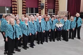 Betty Willoughby (fourth from right) celebrates her achievement  of singing for 70 years with fellow members of the Pendle Ladies’ Choir (formerly Nelson Civic Ladies’ Choir)