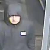 Police want to speak to this man in connection to an attempted robbery at business premises in Rossendale Road in Burnley