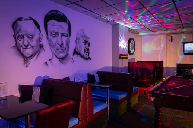 The Secrets bar lounge with the mural of three Burnley FC legends and the Claret and Blue themed booths