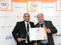 Ishrat Mehdi and Edward Cook of Santa's Pizza collect the Takeaway of the Year accolade in the Food Awards England 2015.