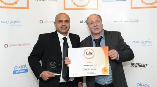 Ishrat Mehdi and Edward Cook of Santa's Pizza collect the Takeaway of the Year accolade in the Food Awards England 2015.