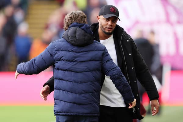 BURNLEY, ENGLAND - MARCH 16: Vincent Kompany, Manager of Burnley, embraces Thomas Frank, Manager of Brentford, prior to the Premier League match between Burnley FC and Brentford FC at Turf Moor on March 16, 2024 in Burnley, England. (Photo by Matt McNulty/Getty Images)