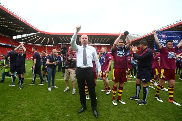LONDON, ENGLAND - MAY 07:  Sean Dyche, manager of Burnley and players celebrate champions of the Sky Bet Championship after the Sky Bet Championship match between Charlton Athletic and Burnley on May 7, 2016 in London, United Kingdom.  (Photo by Charlie Crowhurst/Getty Images)