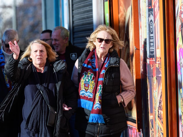 Burnley fans arrive at Turf Moor ahead of the Championship fixture with Blackburn Rovers which ended in a 3-0 victory for the Clarets. Photo: Kelvin Stuttard