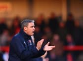 CHELTENHAM, ENGLAND - JANUARY 29:  Michael Duff, manager of Cheltenham issues instructions to his players from the touchline during the Sky Bet League One match between Cheltenham Town and Wigan Athletic at The Jonny-Rocks Stadium on January 29, 2022 in Cheltenham, England. (Photo by Dan Istitene/Getty Images)