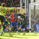 LONDON, ENGLAND - FEBRUARY 24: James Trafford of Burnley makes a save during the Premier League match between Crystal Palace and Burnley FC at Selhurst Park on February 24, 2024 in London, England. (Photo by Alex Davidson/Getty Images)