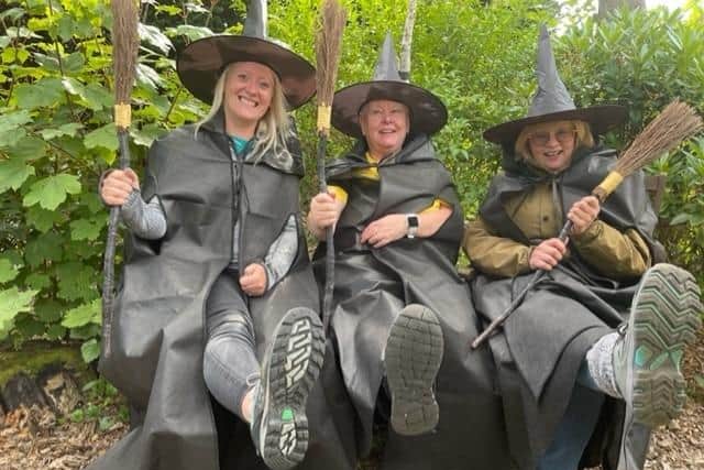 Pendleside staff Leah Hooper, Karen Charlton and Elaine Middleton put their best feet forward for the sponsored Witch Festival walk