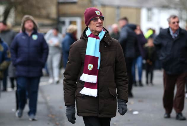 Burnley fans arrive at the stadium prior to the Premier League match between Burnley FC and AFC Bournemouth at Turf Moor on February 22, 2020,