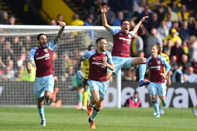 Burnley's players celebrate after Burnley's English midfielder Josh Brownhill (C) scores their second goal during the English Premier League football match between Watford and Burnley at Vicarage Road Stadium in Watford, north-west of London, on April 30, 2022. - Burnley won the game 2-1.