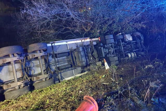 The lorry driver suffered minor injuries after overturning on the southbound M6 between junctions 23 and 24 earlier this morning
