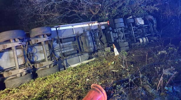The lorry driver suffered minor injuries after overturning on the southbound M6 between junctions 23 and 24 earlier this morning