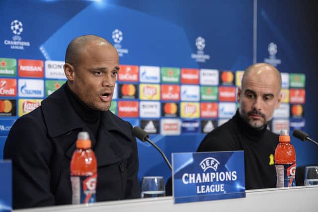 Manchester City's Belgian defender Vincent Kompany (L) and Manchester City's Spanish coach Pep Guardiola hold a press conference on February 12, 2018, in Basel, on the eve of the UEFA Champions League round of 16 football between Basel and Manchester City. / AFP PHOTO / SEBASTIEN BOZON        (Photo credit should read SEBASTIEN BOZON/AFP via Getty Images)