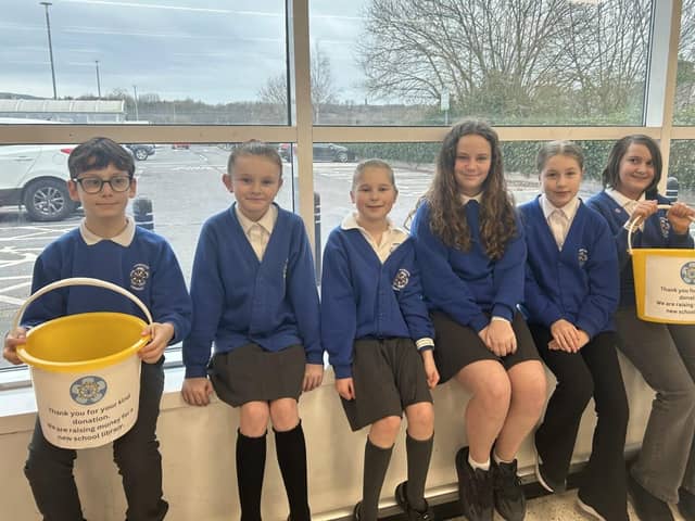 Brunshaw Primary School Pupils with their collection buckets.