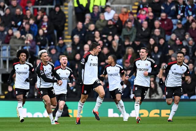 BURNLEY, ENGLAND - FEBRUARY 03: Joao Palhinha of Fulham celebrates scoring his team's first goal with teammates during the Premier League match between Burnley FC and Fulham FC at Turf Moor on February 03, 2024 in Burnley, England. (Photo by Gareth Copley/Getty Images)
