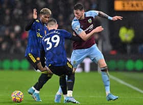 Burnley's Dutch striker Wout Weghorst (R) vies with Manchester United's Scottish midfielder Scott McTominay (C) and Manchester United's English striker Marcus Rashford (L) during the English Premier League football match between Burnley and Manchester United at Turf Moor in Burnley, north west England on February 8, 2022.