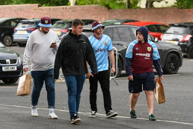 Burnley fans arrive at Turf Moor ahead of the crucial game against Newcastle United. Photo: Kelvin Stuttard