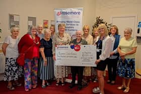 Sue Swire (front right) is presented with St Michael and St John’s Ladies’ Group donation by group chairman Carol Riley (left) and committee