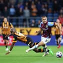 BURNLEY, ENGLAND - AUGUST 16: Taylor Harwood-Bellis of Burnley is challenged by Pervis Estupinan of Hull City during the Sky Bet Championship between Burnley and Hull City at Turf Moor on August 16, 2022 in Burnley, England. (Photo by Clive Brunskill/Getty Images)