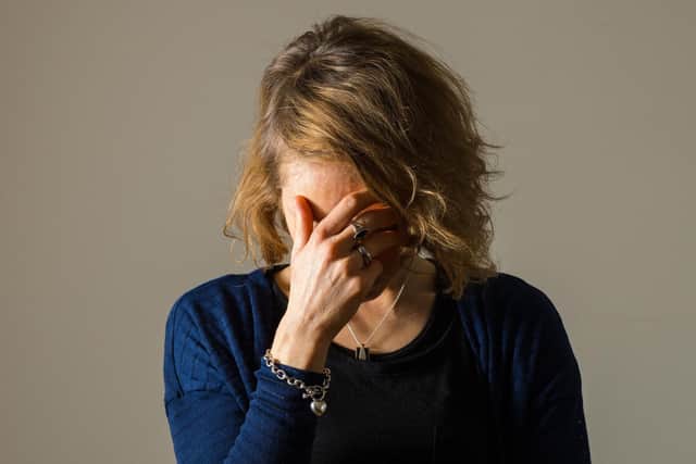 PICTURE POSED BY MODEL: A woman showing signs of depression. Credit: PA/Dominic Lipinski.
