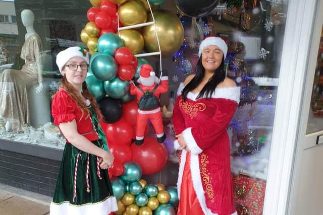 Mrs Clause and the Christmas elf  (aka Sharon Cawse and Paige Anderson) will be handing out free presents for children at the Depher hub in Burnley town centre right up until December 23rd.