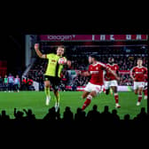 NOTTINGHAM, ENGLAND - SEPTEMBER 18:  Fans look on as a VAR replay shows Sander Berge of Burnley handling the ball before disallowing a goal from Lyle Foster during the Premier League match between Nottingham Forest and Burnley FC at City Ground on September 18, 2023 in Nottingham, United Kingdom. (Photo by Marc Atkins/Getty Images)