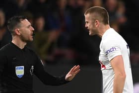 BURNLEY, ENGLAND - FEBRUARY 23: Spurs defender Eric Dier has words with the assistant referee during the Premier League match between Burnley and Tottenham Hotspur at Turf Moor on February 23, 2022 in Burnley, England.  (Photo by Stu Forster/Getty Images)