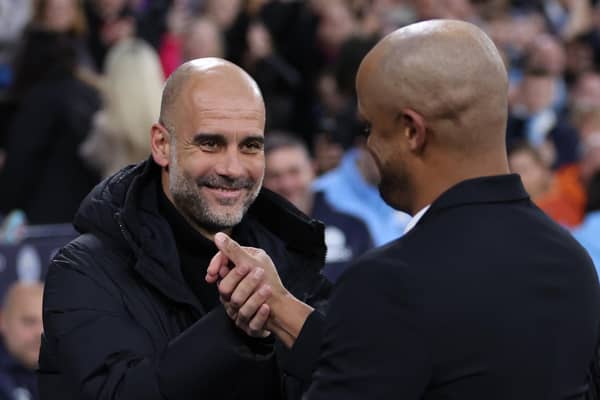MANCHESTER, ENGLAND - MARCH 18: Pep Guardiola, Manager of Manchester City, shakes hands with Vincent Kompany, Manager of Burnley, prior to the Emirates FA Cup Quarter Final match between Manchester City and Burnley at Etihad Stadium on March 18, 2023 in Manchester, England. (Photo by Clive Brunskill/Getty Images)