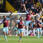 Burnley's players celebrate after Burnley's English midfielder Josh Brownhill (3rd R) scores their second goal during the English Premier League football match between Watford and Burnley at Vicarage Road Stadium in Watford, north-west of London, on April 30, 2022. - RESTRICTED TO EDITORIAL USE. No use with unauthorized audio, video, data, fixture lists, club/league logos or 'live' services. Online in-match use limited to 120 images. An additional 40 images may be used in extra time. No video emulation. Social media in-match use limited to 120 images. An additional 40 images may be used in extra time. No use in betting publications, games or single club/league/player publications. (Photo by Glyn KIRK / AFP) / RESTRICTED TO EDITORIAL USE. No use with unauthorized audio, video, data, fixture lists, club/league logos or 'live' services. Online in-match use limited to 120 images. An additional 40 images may be used in extra time. No video emulation. Social media in-match use limited to 120 images. An additional 40 images may be used in extra time. No use in betting publications, games or single club/league/player publications. / RESTRICTED TO EDITORIAL USE. No use with unauthorized audio, video, data, fixture lists, club/league logos or 'live' services. Online in-match use limited to 120 images. An additional 40 images may be used in extra time. No video emulation. Social media in-match use limited to 120 images. An additional 40 images may be used in extra time. No use in betting publications, games or single club/league/player publications. (Photo by GLYN KIRK/AFP via Getty Images)