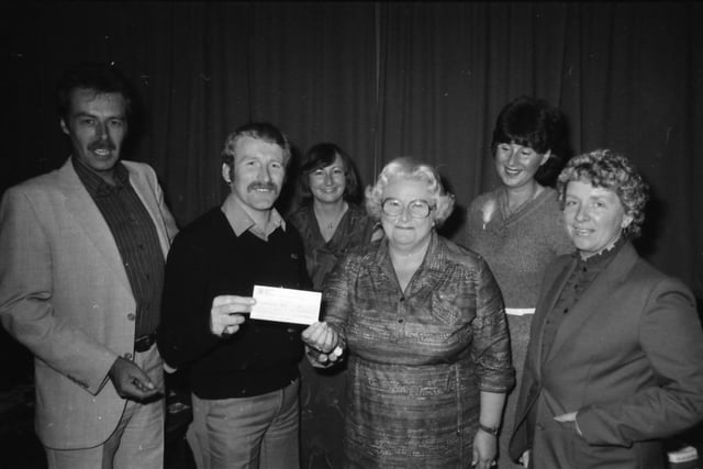 Mrs Strang hands over the cheque to Westway Special School from the ladies’ section of the Burnley branch of the National Association of Licensed House Managers to Mr West and Mr Derek Sheard with other members of the association committee, Mrs Barbara Huyton, Mrs Pauline McCarthy and Mrs Maureen Scaife
