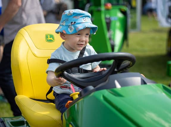 Young Harry Bowker enjoying the tractors at Chipping Agricultural And Horticultural Show