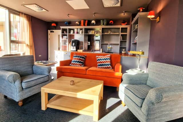 Complimentary coffee and cake was enjoyed in the comfortable lounge area. Image: Bike & Boot Hotel