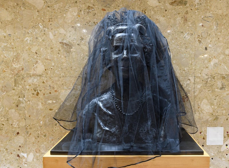 Bust of Queen Elizabeth II is covered in a black mesh at Wyre Civic Centre following her death last week. Photo: Kelvin Stuttard