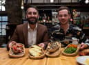 Frankie Musso and Brad Hensby-Musso, co-owners of Mangia Pasta, with a selection of their food. Photo: Kelvin Stuttard