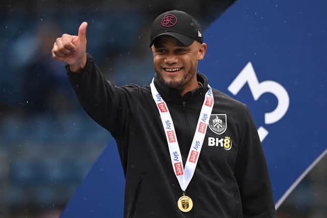 BURNLEY, ENGLAND - MAY 08: Vincent Kompany, Manager of Burnley celebrates promotion to the Premier League after defeating Cardiff City during the Sky Bet Championship between Burnley and Cardiff City at Turf Moor on May 08, 2023 in Burnley, England. (Photo by Gareth Copley/Getty Images)