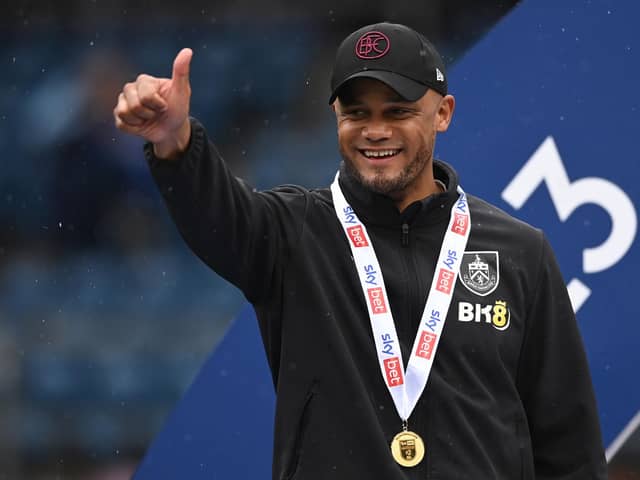 BURNLEY, ENGLAND - MAY 08: Vincent Kompany, Manager of Burnley celebrates promotion to the Premier League after defeating Cardiff City during the Sky Bet Championship between Burnley and Cardiff City at Turf Moor on May 08, 2023 in Burnley, England. (Photo by Gareth Copley/Getty Images)