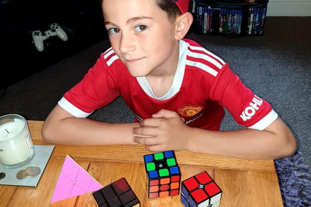Frankie-Rae Winter (seven ) is a Rubik's Cube master after solving four in less than six minutes