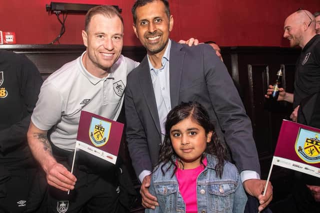 Burnley Council leader Afrasiab Anwar and his daughter Hidayah with Ashley Barnes. ©Andy Ford