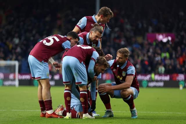 BURNLEY, ENGLAND - DECEMBER 02: Jacob Bruun Larsen of Burnley celebrates with teammates after scoring the team's second goal during the Premier League match between Burnley FC and Sheffield United at Turf Moor on December 02, 2023 in Burnley, England. (Photo by Nathan Stirk/Getty Images)