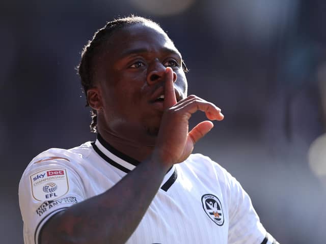 CARDIFF, WALES - APRIL 02: Michael Obafemi of Swansea City interacts with the Cardiff City fans as Hannes Wolf ( not pictured ) celebrates scoring their side's third goal during the Sky Bet Championship match between Cardiff City and Swansea City at Cardiff City Stadium on April 02, 2022 in Cardiff, Wales. (Photo by Ryan Hiscott/Getty Images)